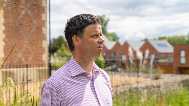 Scott Watkin standing in the garden at Redhill