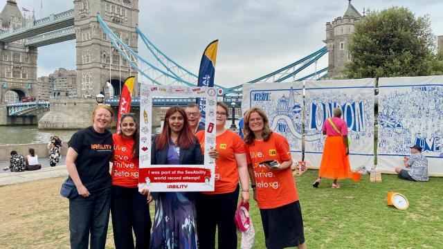 Marina Ahmad, London Assembly Member for Lambeth and Southwark, poses with colleagues alongside our record-breaking mural in Potters Fields Park