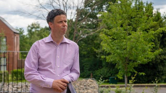 Scott Watkin standing in the garden at Redhill