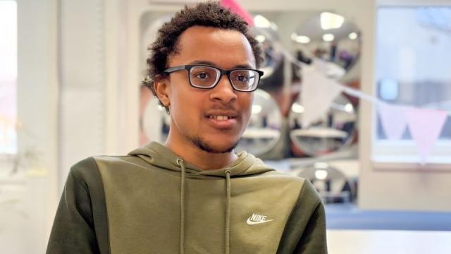Terrance wearing his new glasses at an eye test