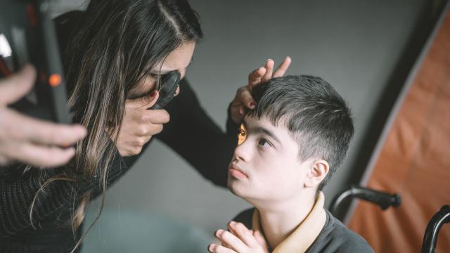 Malvi provides a sight test to Yusuf at a special school.