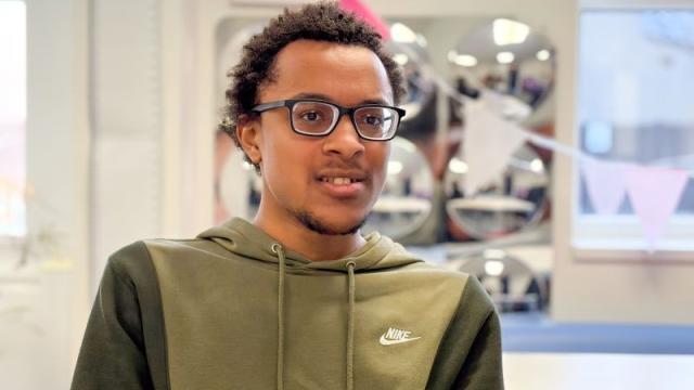Terence wearing his new glasses at an eye test